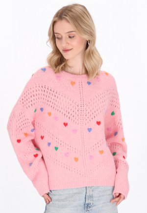 Rosa gestrickter Pullover mit Herzen-Muster in verschiedenen Farben, mit lockerer Passform und geripptem Saum. Strukturierte Offenmaschen-Design an den Ärmeln.