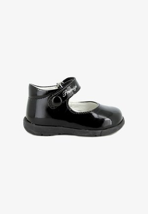 Scarpe Mary Jane in vernice nera con punta rotonda, cinturino regolabile con bottone e suola in gomma texturizzata. Presentano una fodera bianca.