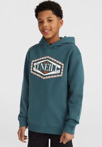 Felpa teal realizzata in morbido tessuto, con un grande logo O'Neill e un motivo geometrico attorno. Polsini e orlo a costine per una vestibilità ottimale.