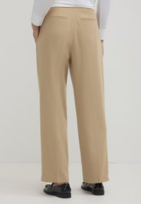 Calliope CON FASCIA ASIMMETRICA  - Stoffhose - beige