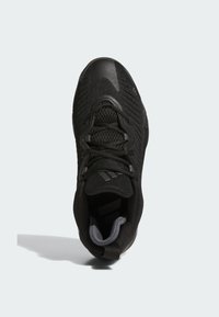 Zapatilla deportiva negra con parte superior de malla texturizada, diseño ligero, cuello acolchado y suela de goma con acentos de marca minimalistas.
