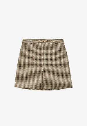 Barna és krémszínű houndstooth mintás szoknya, testre szabott derékkal, enyhén bővülő szabással és elülső hajtás részlettel. Aranyszínű díszgombbal díszítve.