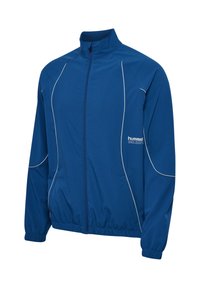Blaues Sportjacke mit Reißverschluss, weißen Paspeln, elastischen Bündchen und Saum sowie dem "hummel"-Logo auf der linken Brustseite.