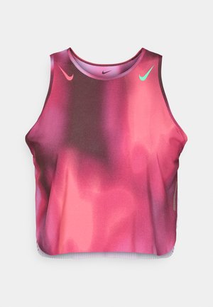 Marineblå og rosa gradient crop-top laget av elastisk stoff. Har Nike-logoer i rosa og grønt, med rund halslinning og ermløs design.