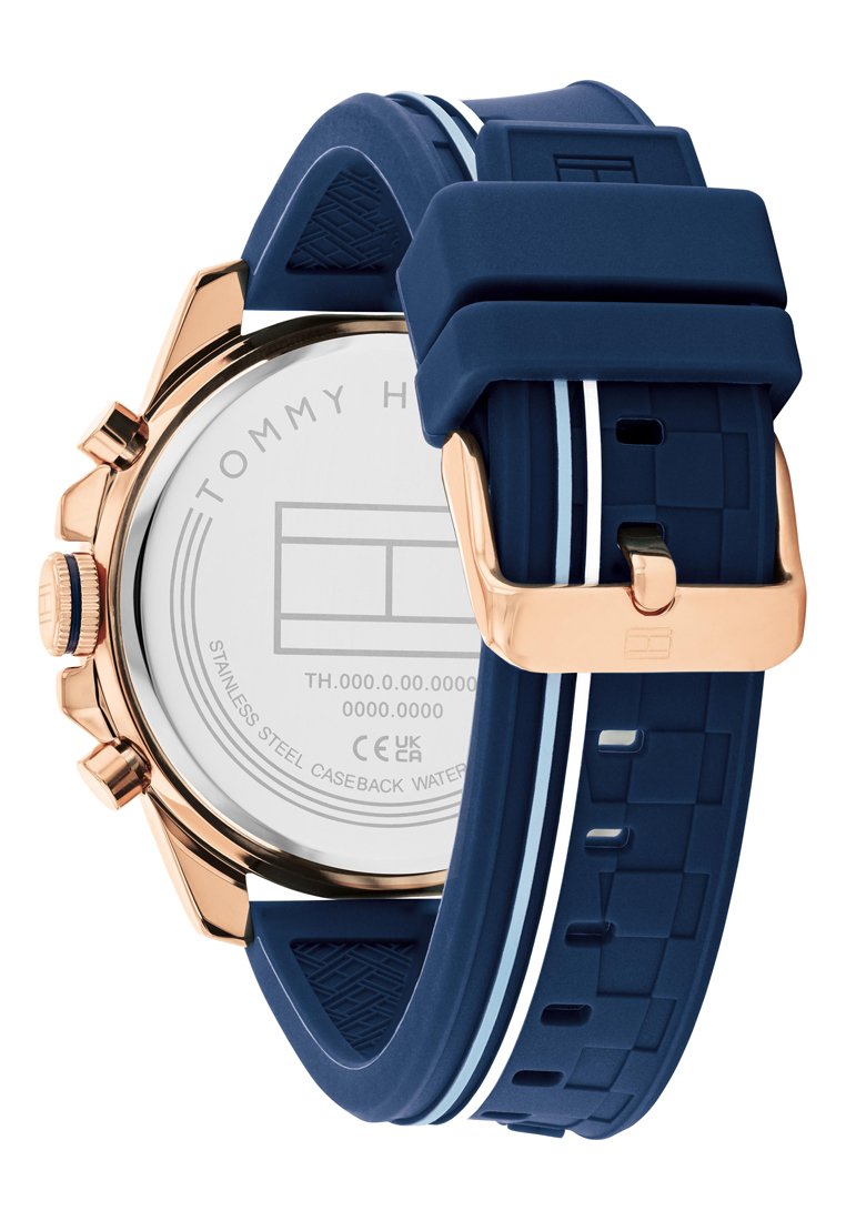 Granatowy zegarek silikonowy z różowo-złotą stalową kopertą, teksturowanym paskiem i białymi paskami akcentującymi, z przezroczystym tyłem z brandingiem.