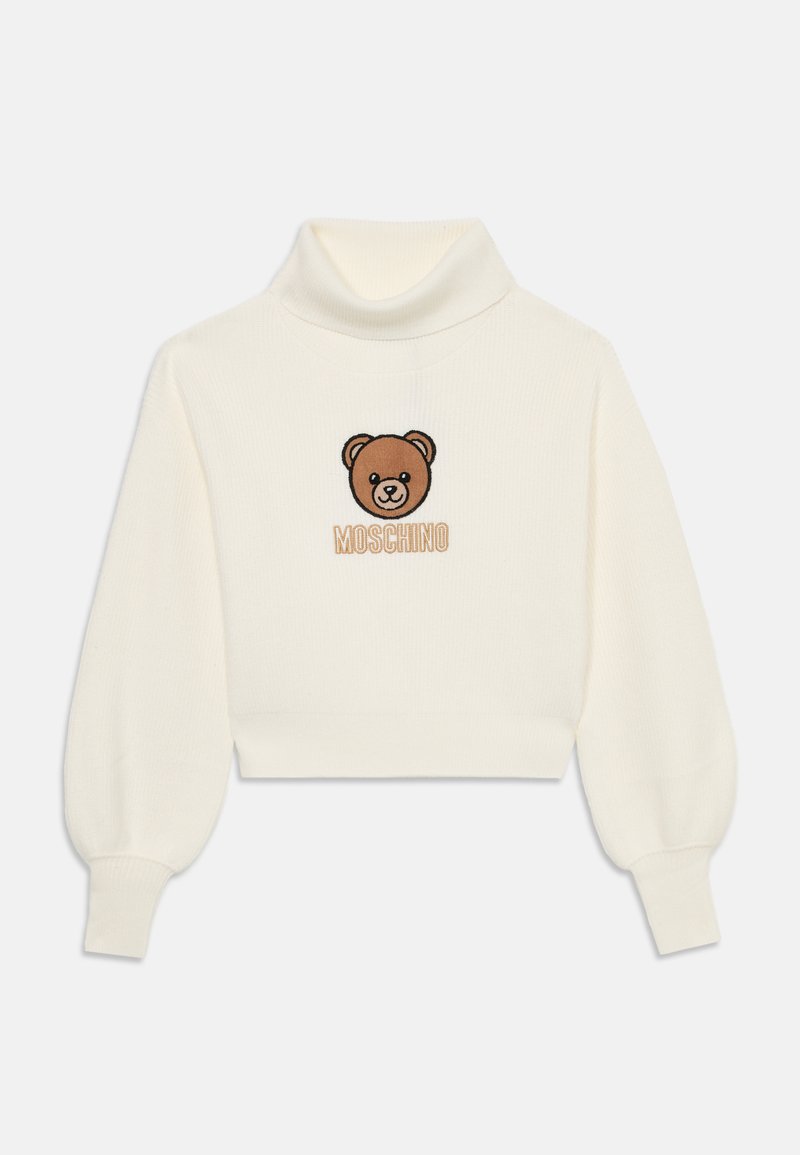 Krämmfärgad kortärmad tröja med hög krage, som har en broderad brun nallebjörn och texten "Moschino" under designen. Texturert stickat material.