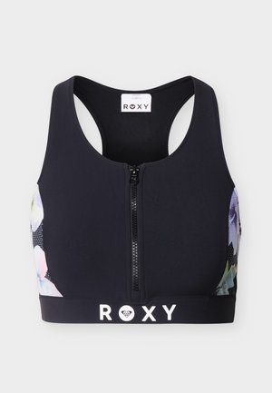 Fekete sportmelltartó elülső cipzárral, racerback kialakítással, virágmintás oldalsó panelek és "ROXY" logóval az alsó szalagon.