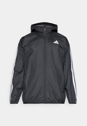 Schwarze leichte Jacke mit Reißverschluss, Kapuze und weißen Seitenstreifen. Hergestellt aus glattem, wasserabweisendem Material mit minimalistischem Design.