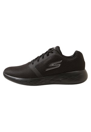 Black mesh athletic sneaker with lace-up closure and cushioned sole, featuring a silver "S" logo on the side.