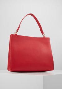 Tommy Hilfiger MODERN SATCHEL - Handtasche - red
