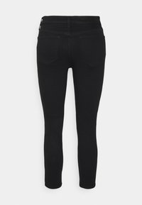 Černé džíny z denimu s úzkým střihem, středně vysokým pasem, dvěma zadními kapsami a hladkou elastickou látkou.