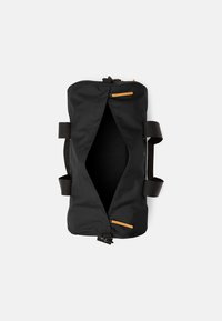 Black duffel bag with a zippered top and orange accents. Made of durable fabric, featuring dual handles and a spacious, unlined interior.