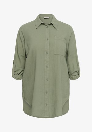 Világoszöld, hosszú ujjú, gombos ing elülső mellzsebbel és felhajtott, gombbal rögzített ujjakkal.