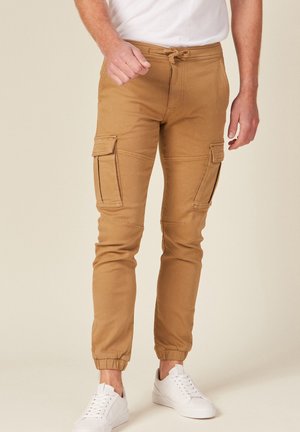 NIEDRIGE ENGE  - Pantalon cargo - vert kaki