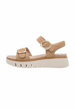 Bež sandali iz semiša z dvema zlatima zaponkama, mehko podlogo za noge in debelim belim profiliranim podplatom. Oblika z odprtimi prsti in nastavljivim trakom.