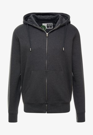 Tummanharmaa vetoketjuhuppari, joka on valmistettu pehmeästä kankaasta. Siinä on kiristettävä huppu, etutaskut sekä ribbireunat hihansuissa ja helmassa.