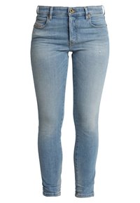 Světle modré džíny typu skinny s designem pěti kapes, s vybledlým ombré, mosazným knoflíkem a zipovým zapínáním. Hladký materiál s mírným elastanem.