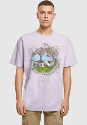 Purple cotton t-shirt featuring a circular graphic with a tree, apples, and a figure lying on grass. Loose fit and short sleeves.