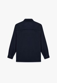 Marineblå langærmet skjorte med button-down krave, lige snit og enkelt baglæns sæm; har knapmanchetter og et struktureret stof.