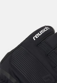 Schwarze Torwart-Handschuhe mit strukturierter Handfläche, flexiblem Sitz und Reusch-Branding. Verfügt über gerippte Abschnitte für verbesserten Grip und Geschicklichkeit.