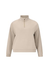 Beige dragkedjeboot med mjuk tyg. Har lång ärm, avslappnad passform och guldfärgad dragkedja vid kragen. Slät textur.