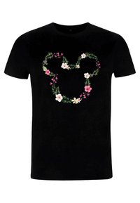 T-shirt en coton noir avec un motif floral en forme de cœur, comportant des fleurs roses et blanches ainsi que des feuilles vertes. Manches courtes et col rond.