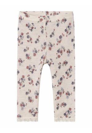 Kukkakuosiset legginsit pehmeässä kankaassa, joissa on vaalea beige tausta vaaleanpunaisilla ja sinisillä kukilla sekä pitsireunus helmoissa.