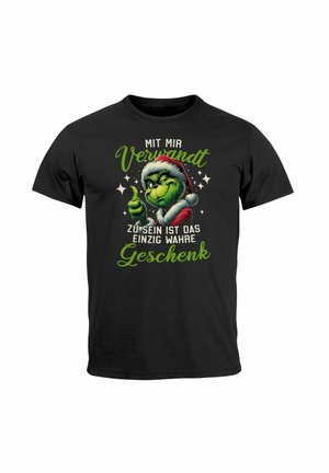 Black cotton T-shirt featuring a cartoon Grinch in a Santa hat, giving a thumbs-up, with green text in German above and below.