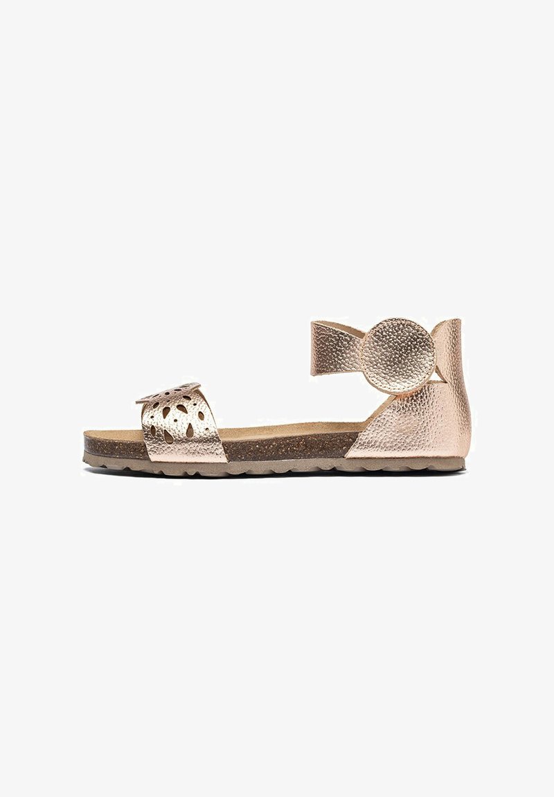 Metallic rose gold sandal with cutout detailing, adjustable ankle strap, textured finish, and flat sole with a slight curve.