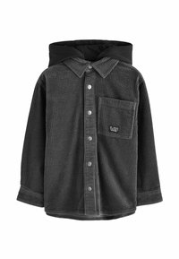 Dunkelgraue Cordjacke mit Knöpfen, schwarzer Kapuze und quadratischem Brusttaschen, die mit einem kleinen gestickten Etikett versehen ist.