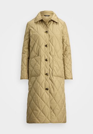 Kreminė siuvinėta striukė su aukštu apykakle, šešiais priekiniais mygtukais ir dviem didelėmis šoninėmis kišenėmis. Tekstūra glotni su deimanto formos raštais.