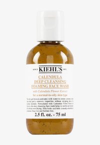 Klare Kunststoffflasche mit einem weißen Klappdeckel, die bernsteinfarbendes Gel enthält. Das Etikett weist schwarzen und orangen Text auf; Größe 2,5 fl. oz. (75 ml).
