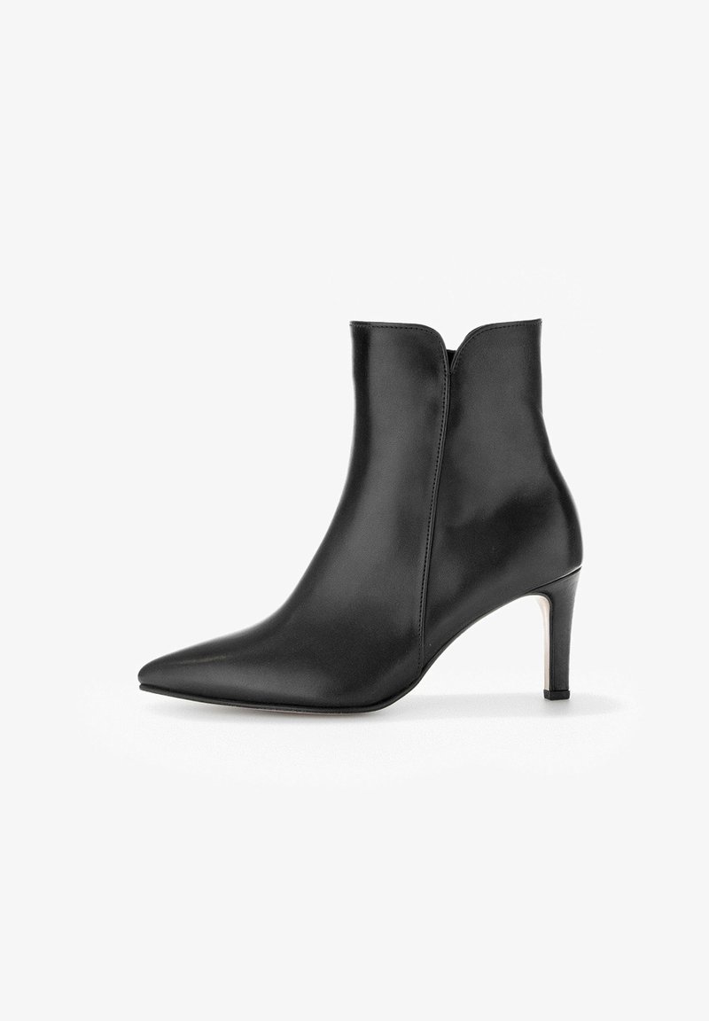 Bottine en cuir noir avec bout pointu et talon haut fin, finition lisse, fermeture éclair latérale, chaussure de mode pour femmes.