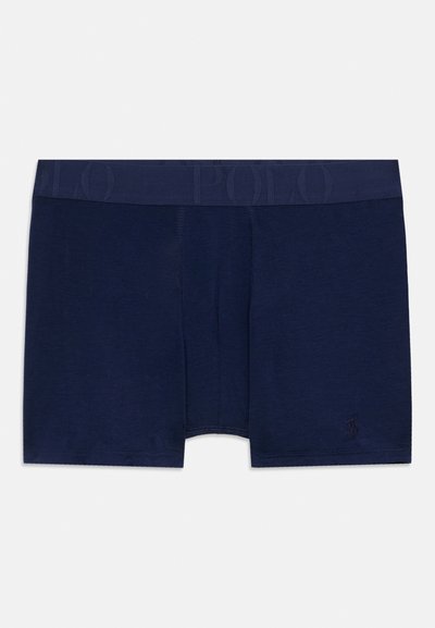 Námornícke modré boxerky vyrobené z jemného materiálu, s pásom zdobeným logom "POLO" a malým vyšitým logom na nohe.