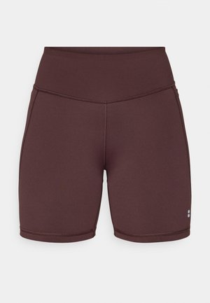 Maroon high-waisted shorts made from stretchy fabric, featuring a smooth texture, fitted shape, and stitched detailing along the edges.