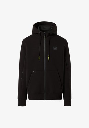 Felpa nera con zip e cappuccio, realizzata in un tessuto morbido. Presenta tirazip verdi a contrasto, due tasche frontali e dettagli cuciti.