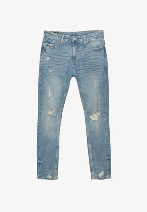 Vaaleansiniset slim-fit farkut, joissa on kuluneita kohtia ja repaleisia yksityiskohtia etureisissä ja polvissa, viisi taskua ja napitus.