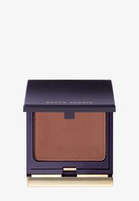 Kompakt bronzer med et mat, medium brunt puder indeni. Dyb lilla etui med gyldne accenter, der har en magnetisk lukning.
