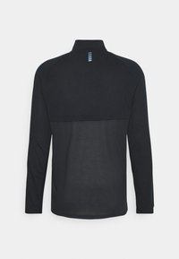 Long-sleeve black top with a textured fabric, featuring a high collar and a back yoke design with vertical blue stripes.