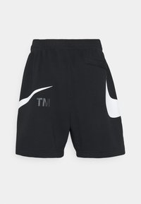 Czarne sportowe szorty wykonane z gładkiej tkaniny. Na lewej nogawce znajduje się duże białe logo Nike oraz czarne oznaczenie "TM".