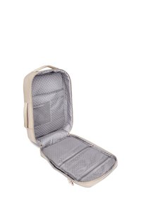 Beige kosmetická taštička s šedým puntíkovaným interiérem. Obsahuje síťovou kapsu a několik přihrádek. Hladký materiál, zipové uzavírání a držadlo.