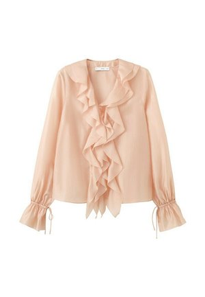 Blouse rose pâle à manches longues avec un volant superposé sur le devant et aux poignets, doté de liens à nouer sur les manches.