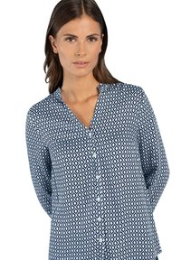 Navy and white patterned button-up shirt with a V-neck, long sleeves, and diamond-shaped designs throughout. Soft fabric texture.