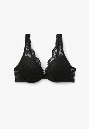 Soutien-gorge en dentelle noire avec une forme en V profonde, des bords festonnés et une texture lisse. Dispose de bonnets mousse et de larges bretelles en dentelle.