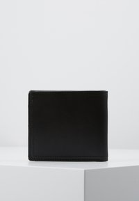 Black leather wallet featuring a smooth texture, bi-fold design, and visible stitching along the edges. Compact and rectangular shape.