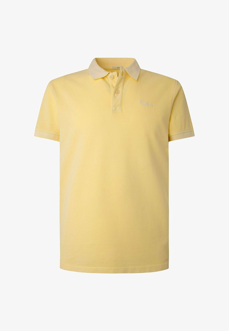 Polo en coton jaune à manches courtes, avec une patte de boutonnage à deux boutons et un logo brodé sur la poitrine gauche. Texture douce et design classique.