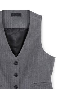 Gilet à rayures grises avec trois boutons noirs, col en V, deux poches avant et doublure intérieure noire, étiqueté taille petite.