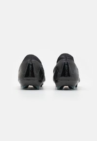 Black football boots with a textured upper, sock-like collar, and rubber studs for traction. Features "Mercurial" branding along the heel.