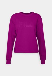 Fioletowa bluza z długim rękawem wykonana z bawełny, z okrągłym dekoltem i wytłoczonym logo "FILA" z przodu. Regularny krój.