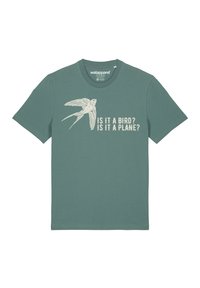 Minzgrünes Baumwoll-T-Shirt mit einem stilisierten fliegenden Vogeldesign und dem in Creme gedruckten Text "Ist es ein Vogel? Ist es ein Flugzeug?"